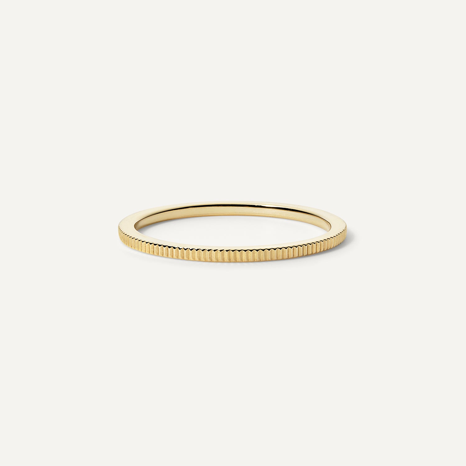 14k gold ridged wedding band.